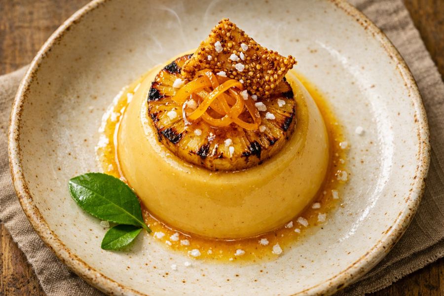 Lucuma & Toasted Corn Panna Cotta with Charred Pineapple, Candied Ají Amarillo & Crispy Quinoa Tuile